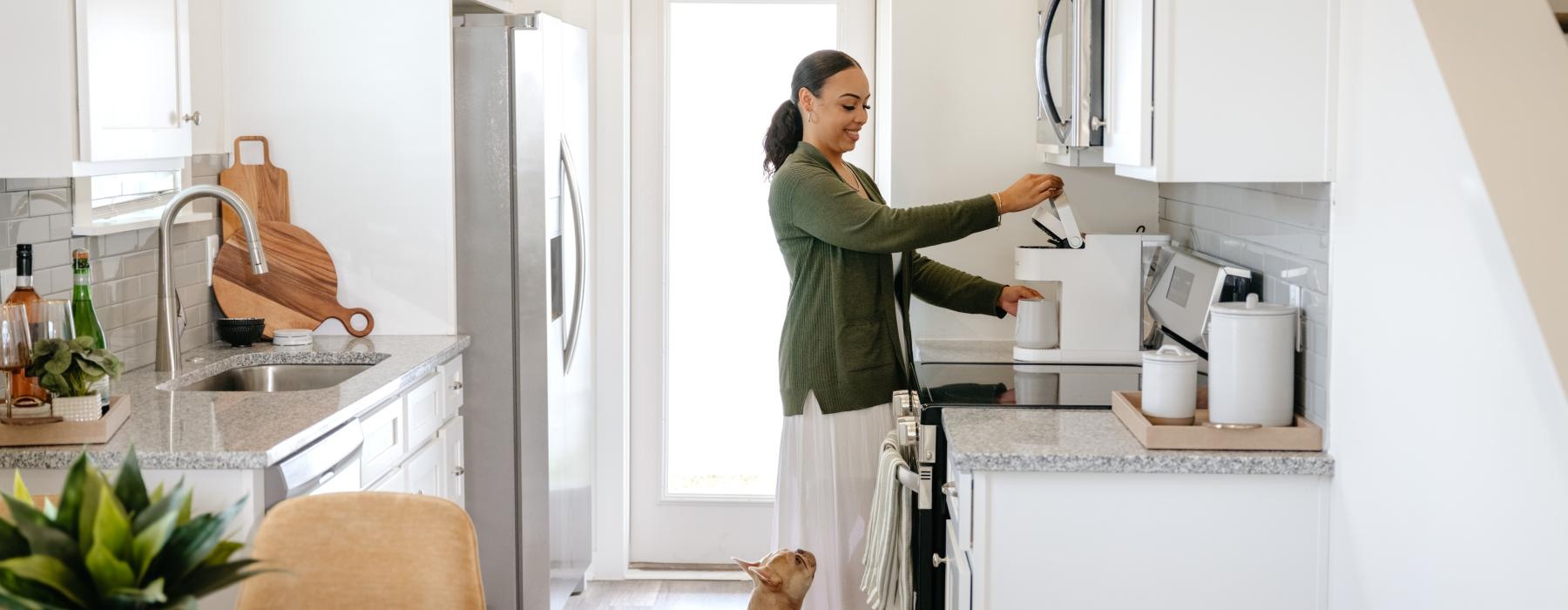 woman in the kitchen with her dog