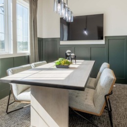 large table and chairs in bright conference room