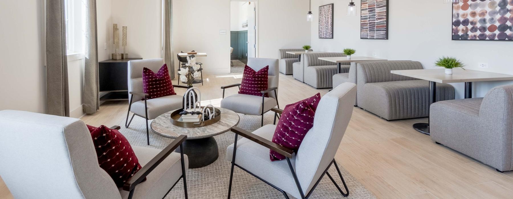 tables and plush seating throughout clubhouse lounge